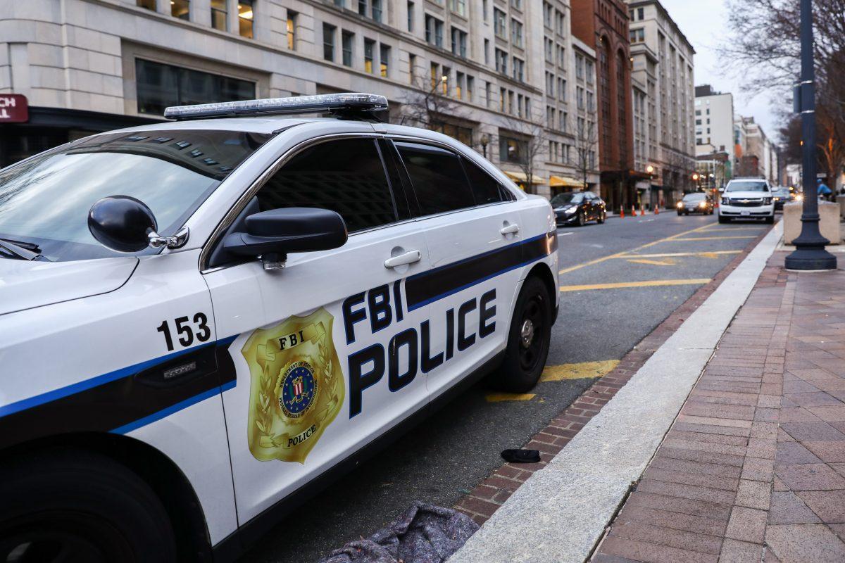 An FBI police car is parked outside the Federal Bureau of Investigation headquarters in Washington on Jan. 7, 2019. (Samira Bouaou/The Epoch Times)