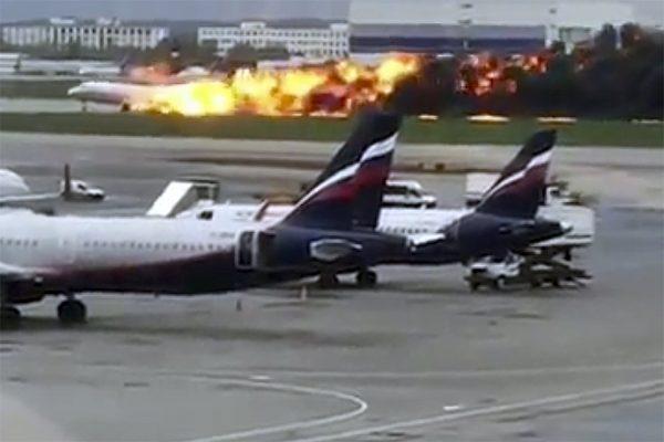 The SSJ-100 aircraft of Aeroflot airlines on fire during an emergency landing in Sheremetyevo airport in Moscow on May 5, 2019. (@artempetrovich via AP)