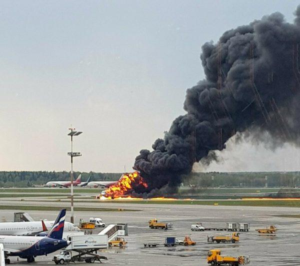 In this image provided by Riccardo Dalla Francesca shows smoke rises from a fire on a plane at Moscow's Sheremetyevo airport on May 5, 2019. (Riccardo Dalla Francesca via AP)
