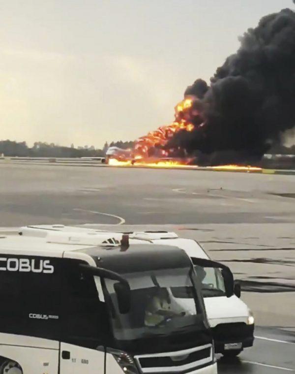 This image taken from video and provided on the Twitter feed of Mikhail Norenko, shows smoke from a plane on fire at Moscow's Sheremetyevo airport on May 5, 2019. (Mikhail Norenko/Twitter via AP)