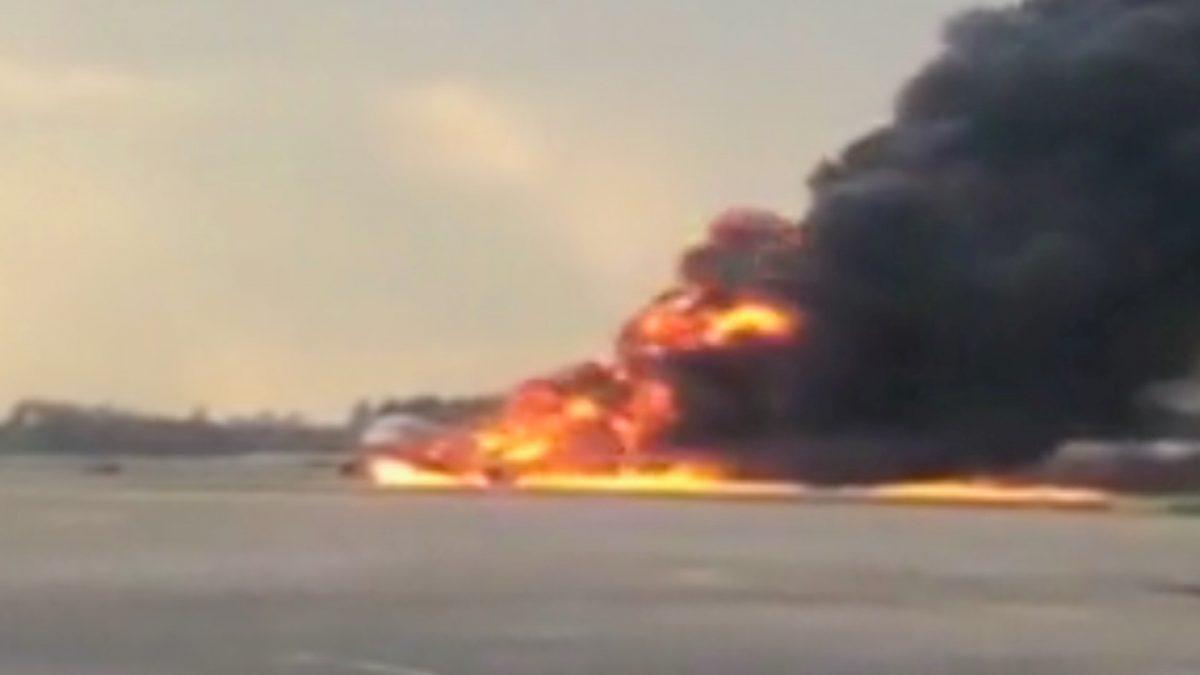 A Sukhoi passenger plane is engulfed in flames after it made an emergency landing due to an onboard fire at Sheremetyevo International Airport, outside Moscow, Russia on May 5, 2019. (Mikhail Norenko via Reuters)