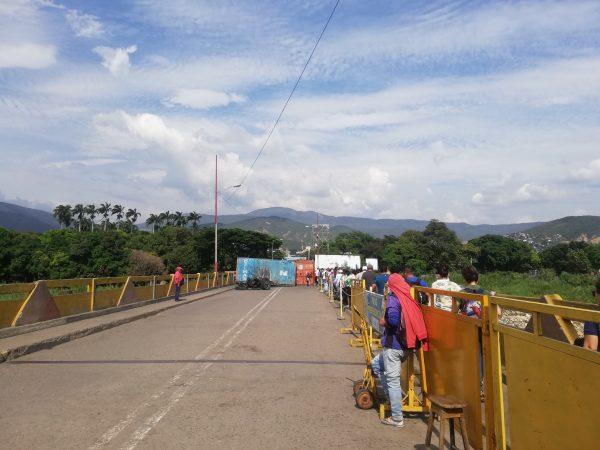The metal containers placed on the Simón Bolívar Bridge to prevent the entrance of aid from Colombia into Venezuela have slowed migration flows pushing many towards taking illegal border crossings ran by armed groups. (Luke Taylor for The Epoch Times)