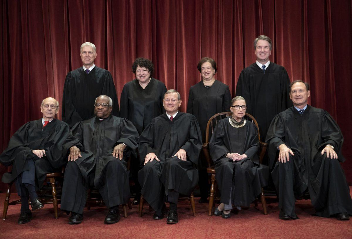The justices of the U.S. Supreme Court gather for a formal group portrait to include the new Associate Justice, top row, far right, at the Supreme Court Building in Washington, on Nov. 30, 2018. (J. Scott Applewhite/AP Photo)