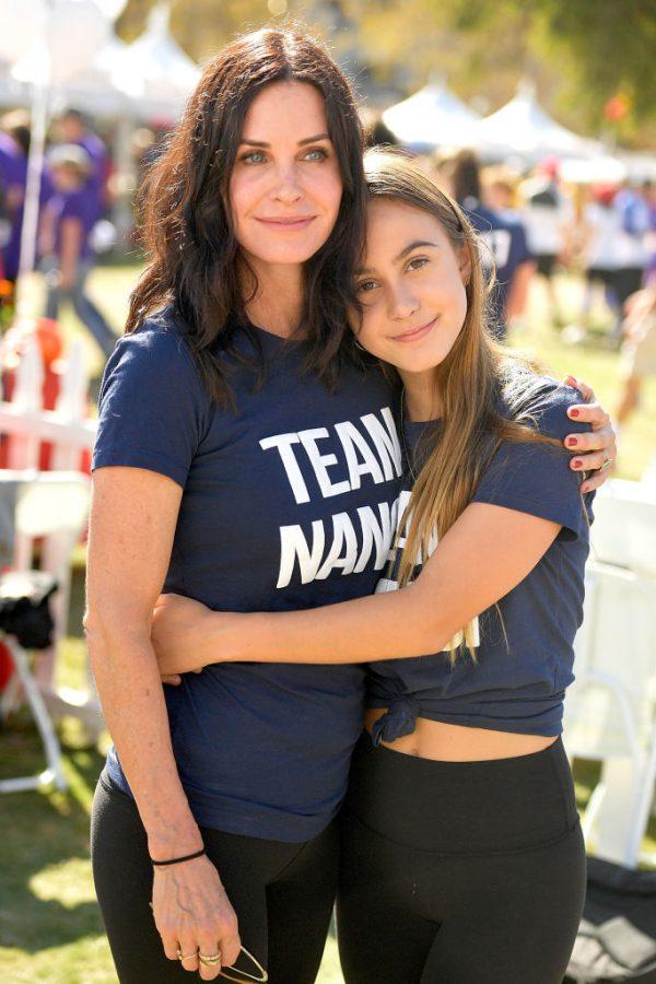 Courteney and Coco show off their matching T-shirts at a charity walk in 2017 (©Getty Images | <a href="https://www.gettyimages.com/detail/news-photo/courteney-cox-and-coco-arquette-attend-the-nanci-ryders-news-photo/861716938">Matt Winkelmeyer</a>)