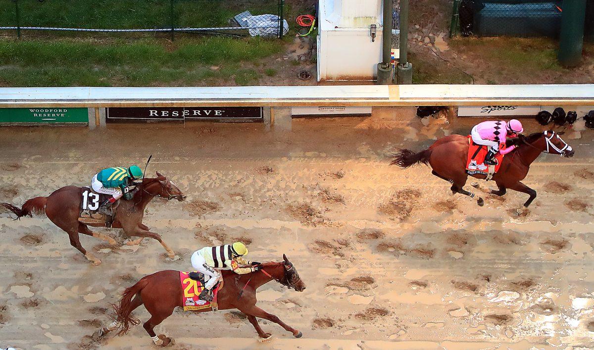 Country House #20, ridden by jockey Flavien Prat, crosses the finish line to win the 145th running of the Kentucky Derby at Churchill Downs in Louisville, Ky., on May 4, 2019. Country House #20 was declared the winner after a stewards review disqualified Maximum Security #7. (Jamie Squire/Getty Images)