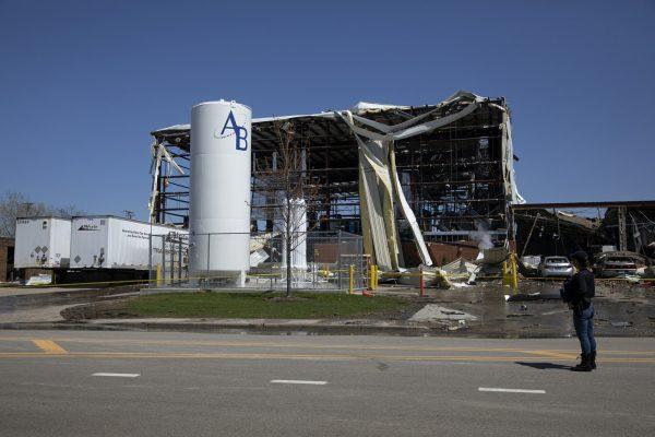 Debris can be seen as emergency personnel and others search and clear the scene of an explosion and fire at AB Specialty Silicones chemical plant in Waukegan, Ill., on May 4, 2019. (Erin Hooley/Chicago Tribune via AP)