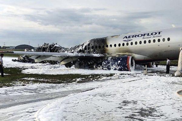 The Sukhoi SSJ100 aircraft of Aeroflot airlines is covered in fire retardant foam after an emergency landing in Sheremetyevo airport in Moscow on May 5, 2019. (Moscow News Agency photo via AP)