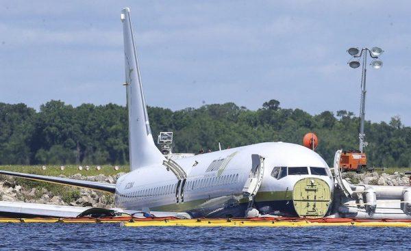 A charter plane carrying 143 people and traveling from Cuba to north Florida sits in a river at the end of a runway in Jacksonville, Fla., on May 4, 2019. (Gary McCullough/AP Photo)