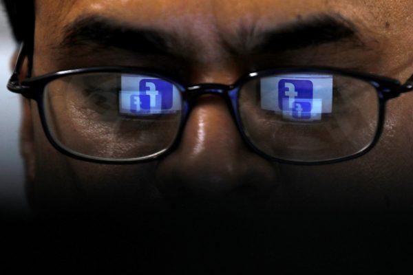 Facebook logo is reflected in glasses in this picture illustration taken on April 1, 2019. (Akhtar Soomro/Reuters)