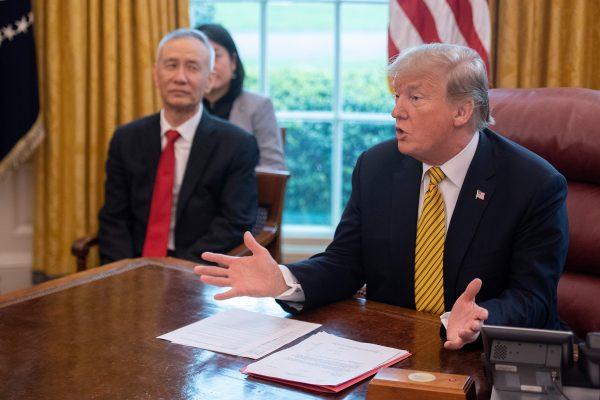 Then-president Donald Trump (R) speaks during a trade meeting with China's Vice Premier Liu He (C) in the Oval Office at the White House in Washington, D.C., on April 4, 2019. (Jim Watson/AFP/Getty Images)