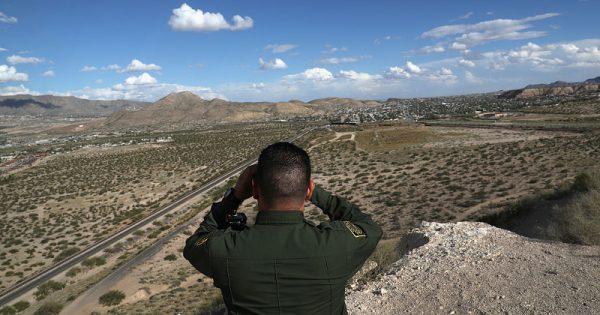 A Border Patrol Official looks out into the distant areas around Sunland Park, New Mexico on October 4, 2016. (John Moore/Getty Images)