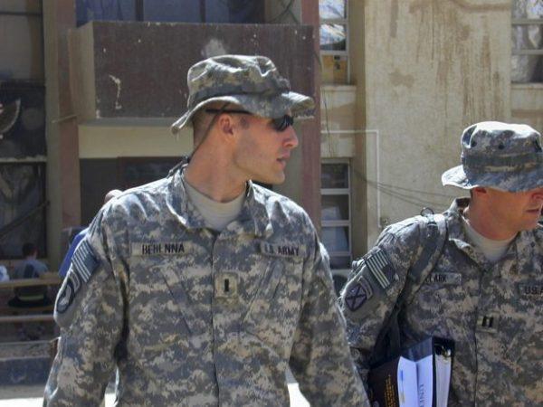 1st Lt. Michael C. Behenna (L), and his defense attorney Capt. Tom Clark walk in Camp Speicher, a large U.S. base near Tikrit, north of Baghdad, Iraq, on Sept. 21, 2008. (Vanessa Gera/AP Photo)