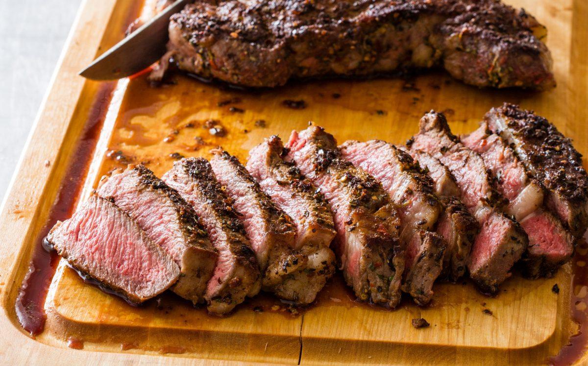 Sliced steak on serving board. (Daniel J. van Ackere)
