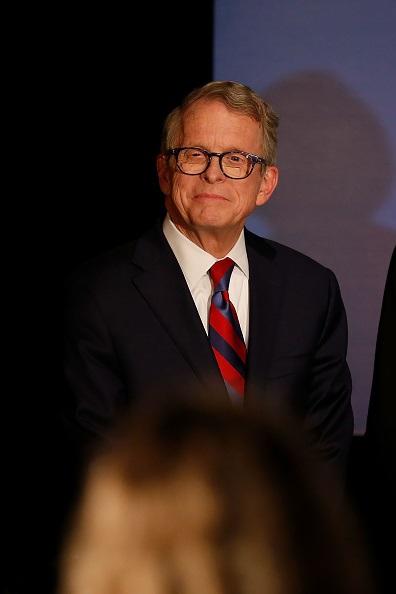 Republican Gubernatorial Candidate Ohio Attorney General Mike DeWine listens as Governor John Kasich gives a speech endorsing DeWine ahead of Tuesday's elections during a campaign event at the Boat House at Confluence Park in Columbus, Ohio, on Nov. 2, 2018.(Kirk Irwin/Getty Images)