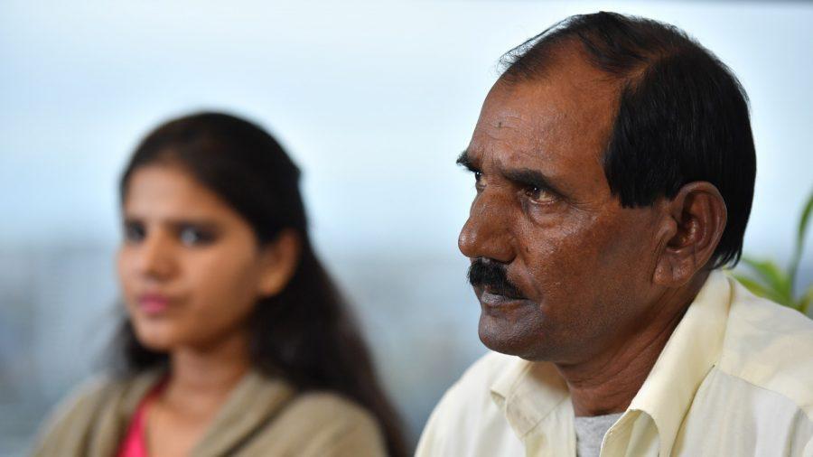 Ashiq Mesih (R) and Eisham Ashiq, the husband and daughter of Asia Bibi, speak during an interview with AFP in London, on Oct. 12, 2018. (Ben Stansall/AFP/Getty Images)