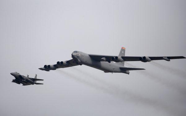 A U.S. Air Force B-52 (R) flies over Osan Air Base in Pyeongtaek, South Korea, on Jan. 10, 2016. (Kim Hong-Ji/Reuters)