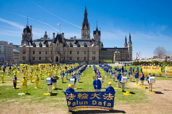 Falun Dafa adherents take part in celebrations marking Falun Dafa Day on Parliament Hill, Ottawa, on May 8, 2019. (Evan Ning/The Epoch Times)