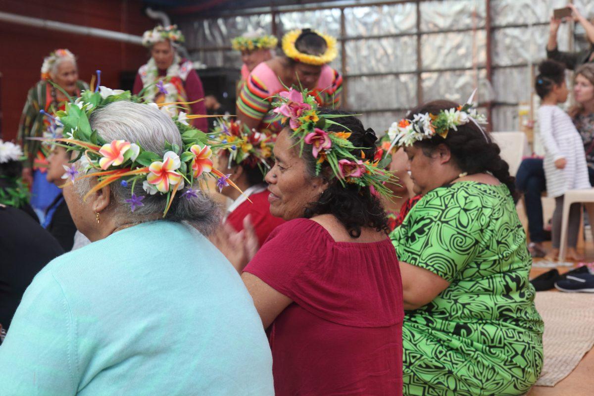 Pacific Island men and women wear flower headdresses, normally made from native flowers and in specific colors depending on the island and village they come from. (Lorraine Ferrier/The Epoch Times)