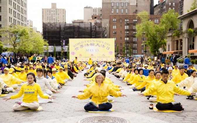 Falun Dafa practitioners participate in a World Falun Dafa Day activity at Union Square, New York City, on May 11, 2017. (©The Epoch Times | <a href="https://www.theepochtimes.com/">Samira Bouaou</a>)