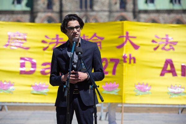 David Bhatti, an aid for Conservative MP Garnett Genuis, speaks at an event celebrating Falun Dafa Day on Parliament Hill, Ottawa, on May 8, 2019. (Evan Ning/The Epoch Times)