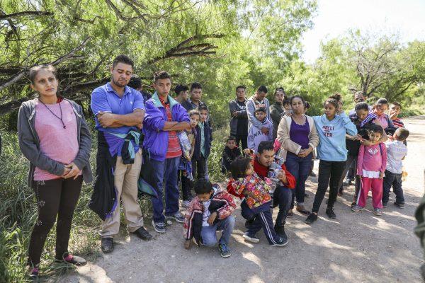 A group of illegal aliens who have just crossed the Rio Grande from Mexico near McAllen, Texas, on April 18, 2019. (Charlotte Cuthbertson/The Epoch Times)