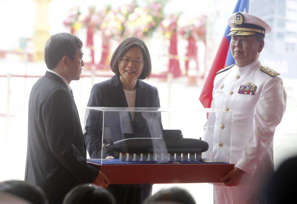 Taiwan's President Tsai Ing-wen, center, looks at the first indigenous submarine model during a groundbreaking ceremony for the island's naval submarine factory in Kaohsiung, southern Taiwan on May 9, 2019. (Chiang Ying-ying/AP Photo)