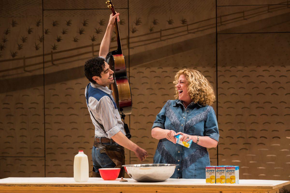 Curly (Damon Daunno) and Aunt Eller (Mary Testa), as she makes corn bread onstage. (Little Fang Photo)