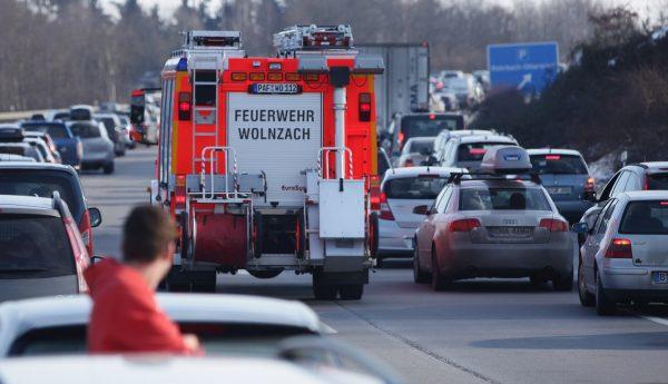 In this file image a firetruck makes its way past halted cars on the A9 highway near Ottersried, Germany, on Jan. 29, 2011. (Sean Gallup/Getty Images)