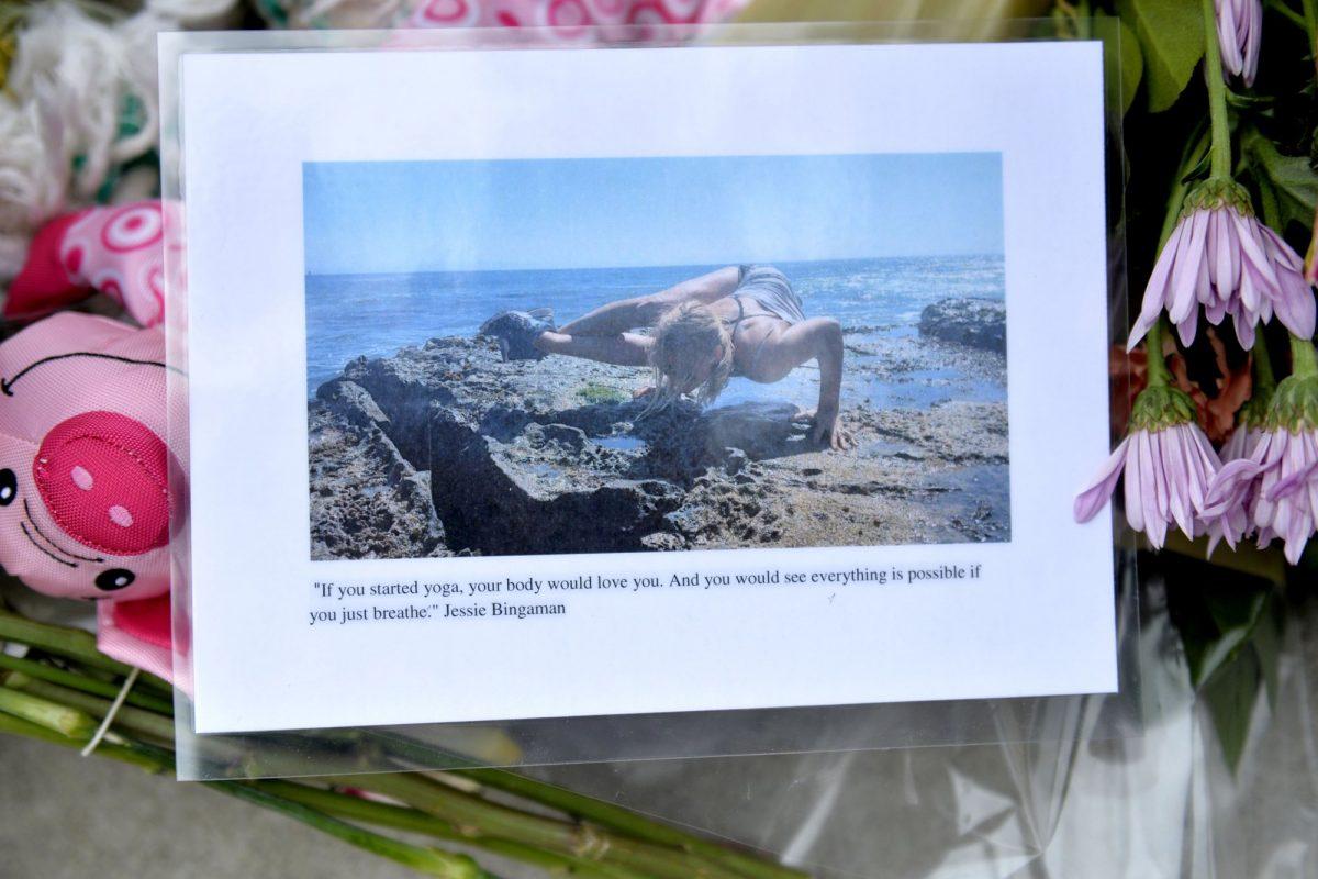 A photo is displayed on May 8, 2019, at the memorial for Jessica Bingaman, a popular dog walker, who was killed along with five of six dogs she was transporting in Long Beach, Calif. (Brittany Murray/The Orange County Register via AP)