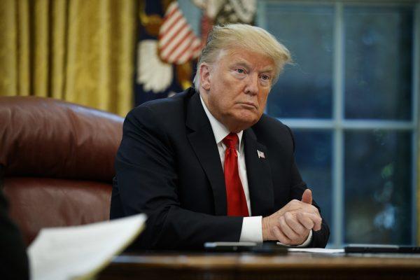 President Donald Trump listens to a question during an interview with The Associated Press in the Oval Office of the White House, on Oct. 16, 2018. (Evan Vucci/AP Photo)