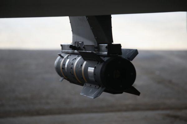 A Hellfire missile hangs from a U.S. Air Force MQ-1B Predator unmanned aerial vehicle at a secret air base in the Persian Gulf region on Jan. 7, 2016. (John Moore/Getty Images)