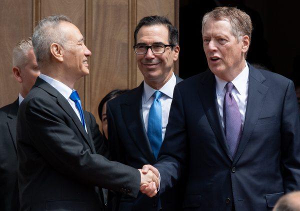 Chinese Vice Premier Liu He (L) shakes hands with US Trade Representative Robert Lighthizer (R) alongside US Treasury Secretary Steven Mnuchin (C) after trade negotiations in Washington, D.C., on May 10, 2019. (Saul Loeb/AFP/Getty Images)