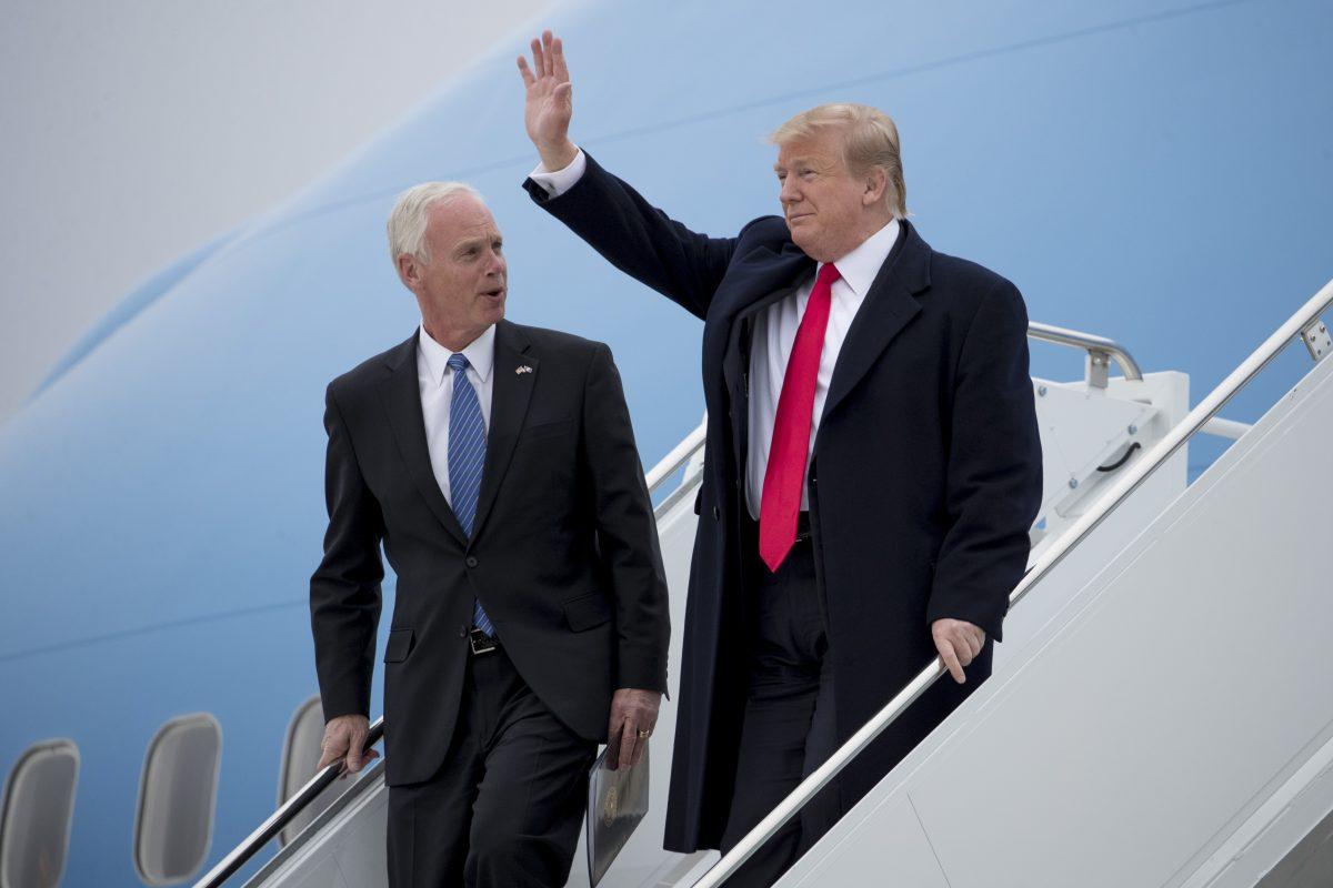 President Donald Trump accompanied by Sen. Ron Johnson (R-Wis.) arrives at Green Bay Austin Straubel International Airport in Green Bay, Wis., on April 27, 2019. (Andrew Harnik/AP Photo)
