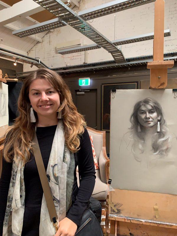Lucy Revill, author of The Residents blog, stands next to her portrait in progress on Tatyana Kulida's easel. (Steffen Schubert)