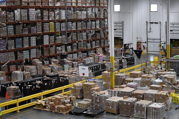 Products, stacked on shelves, are seen at the Amazon fulfillment center in Baltimore, Md., on April 30, 2019. (Clodagh Kilcoyne/Reuters)