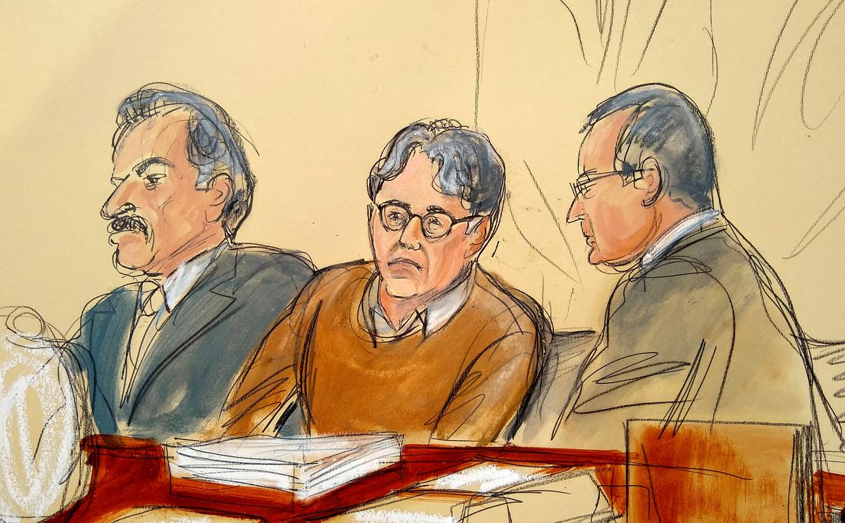 In this courtroom drawing, defendant Keith Raniere, center, is seated between his attorneys Paul DerOhannesian, left, and Marc Agnifilo during the first day of his sex trafficking trial on May 7, 2019. (Elizabeth Williams via AP)