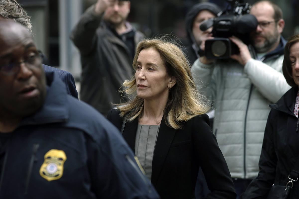 Felicity Huffman arrives at federal court in Boston, where she pleaded guilty to charges in a nationwide college admissions bribery scandal, on May 13, 2019. (Steven Senne/AP Photo)