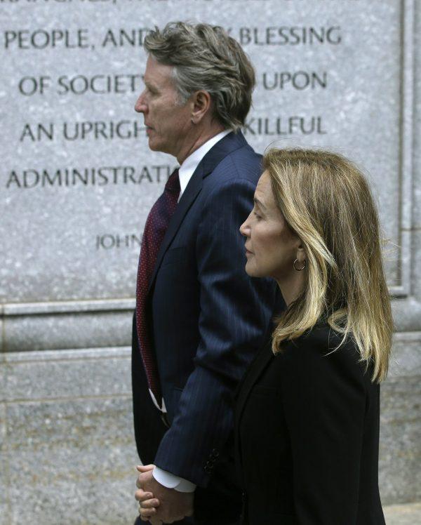 Actress Felicity Huffman arrives with her brother Moore Huffman Jr., at federal court in Boston, where she was scheduled to plead guilty to charges in a nationwide college admissions bribery scandal, on May 13, 2019. (Steven Senne/AP Photo)