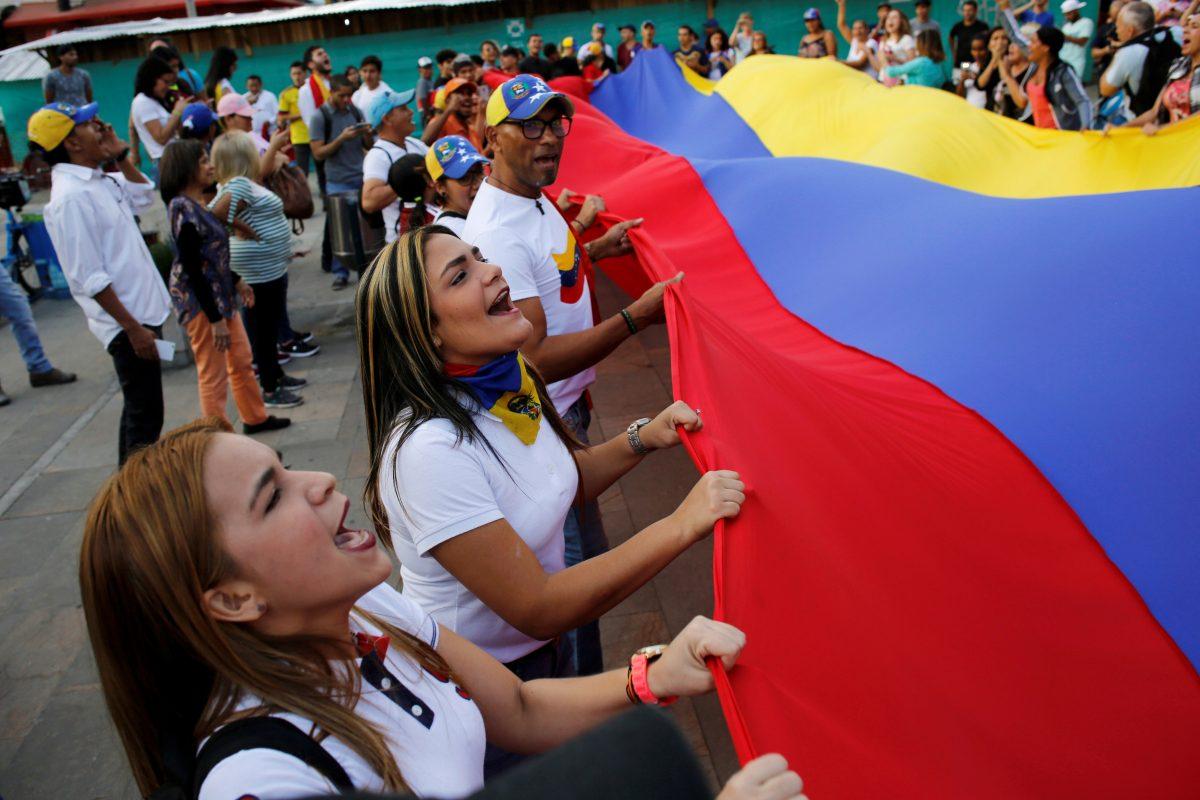 Venezuelan residents in Colombia protest against Nicolas Maduro's government in Medellin, Colombia, on May 1, 2019. (David Estrada/Reuters)