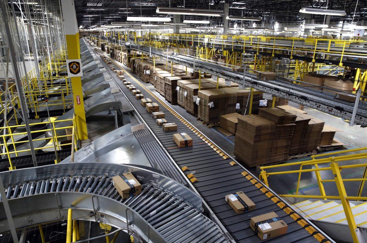 Packages ride on a conveyor system at an Amazon fulfillment center in Baltimore. Amazon, on Aug. 3, 2017. (Patrick Semansky/AP Photo)