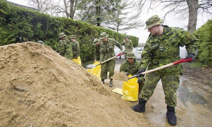 Army to Remain in Quebec Flood Zones to Help With Cleanup Operations