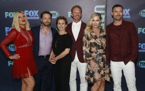 Tori Spelling, from (L), Jason Priestley, Gabrielle Carteris, Ian Ziering, Jennie Garth, and Brian Austin Green, from the cast of "BH90210," attend the FOX 2019 Upfront party at Wollman Rink in Central Park on May 13, 2019, in New York. (Andy Kropa/Invision/AP)