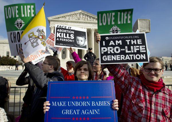 Anti-abortion activists protest outside of the U.S. Supreme Court on Jan. 18, 2019, (Jose Luis Magana/AP)
