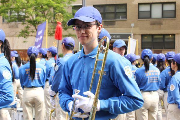 Olivier Grenier-Leboeuf, a member of the Tian Guo Marching Band, at the United Nations Plaza on May 16, 2019. (Eva Fu/The Epoch Times)
