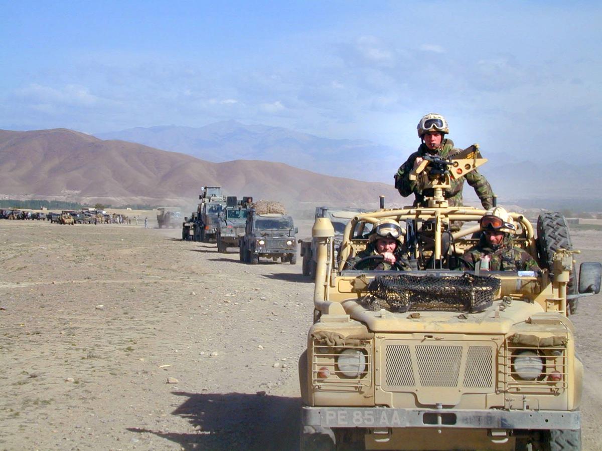 A convoy of Royal Marine Commandos makes its way through the Afghan countryside April 30, 2002, on its way to the Forward Operating Base (FOB) as the troops commence Operation Snipe in the southeast of Afghanistan. (Royal Navy/Getty Images)