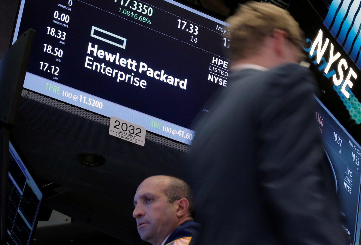 A trader passes by the post where Hewlett Packard Enterprise Co., is traded on the floor of the New York Stock Exchange (NYSE) in New York, on May 25, 2016. (Brendan McDermid/Reuters)