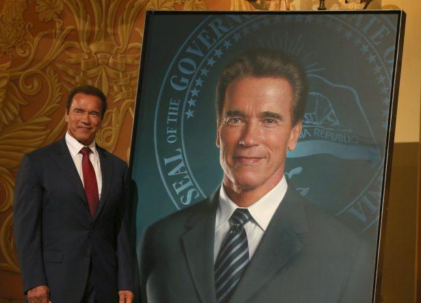  Former California Gov. Arnold Schwarzenegger poses next to his gubernatorial portrait at the unveiling in the Rotunda of the State Capitol in Sacramento, Calif., on Sept. 8, 2014. (Justin Sullivan/Getty Images)