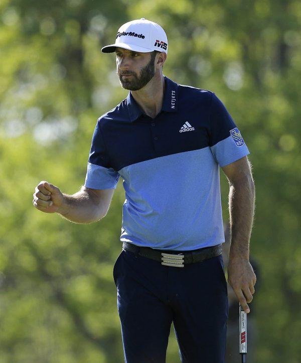 Dustin Johnson reacts after sinking a putt on the 14th green during the third round of the PGA Championship golf tournament at Bethpage Black in Farmingdale, N.Y., on May 18, 2019. (Julio Cortez/Photo via AP)