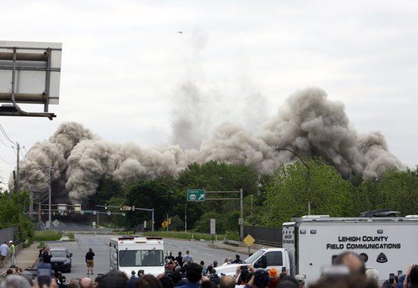 Dust and debris fill the air as Martin Tower, former world headquarters of Bethlehem Steel, implodes in Bethlehem, Pa., on May 19, 2019. (Jacqueline Larma/Photo via AP)