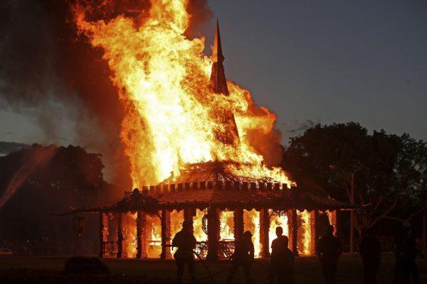 The "Temple of Time" built as a memorial to the 17 victims of a shooting at Marjory Stoneman Douglas High School is seen on fire during a ceremonial burning in Coral Springs, Fla., on May 19, 2019. (John McCall/South Florida Sun-Sentinel via AP)